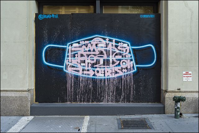 A street art depiction of a face mask in NYC.